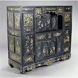 A late 19th century Chinese huang huali side cabinet, the front decorated overall with detailed moth