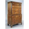 Image 1 : A George II walnut crossbanded chest on chest, the concave cornice above three short and three long.