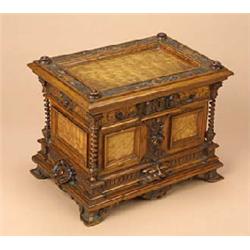 A Continental walnut and ash panelled jewellery box, the rectangular hinged, panelled top carved wit