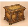 Image 1 : A Continental walnut and ash panelled jewellery box, the rectangular hinged, panelled top carved wit