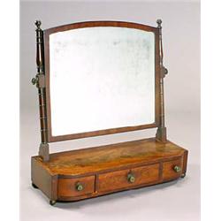 A George IV mahogany dressing table mirror, the arched rectangular crossbanded plate on ring turned.