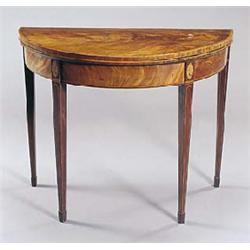 A George III mahogany crossbanded and shell inlaid foldover card table on square tapering legs, 92cm