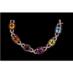 BRACELET: (1) 18k WG diamond and multi-colored gemstone bracelet 7 1/2  long, set with (1) oval citr