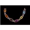 Image 1 : BRACELET: (1) 18k WG diamond and multi-colored gemstone bracelet 7 1/2" long, set with (1) oval citr