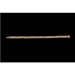 BRACELET: (1) Diamond and 18ky bracelet 7  long with 2 rows of (172) princess cut diamonds SI2-I1 cl