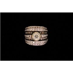 RING: (1) Diamond and 18k WG ring. Bezel set in center is (1) rbc diamond, approx. 6.00mm in diamete