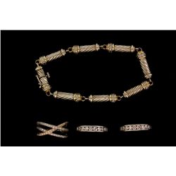 BRACELET: (1) 14kW and YG link bracelet 7  long. Set with (40) approx.  0.01ct. rbc diamonds, color 