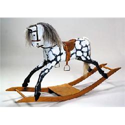 A dapple grey rocking horse on bow rockers, with painted fibreglass body fitted with horsehair mane.