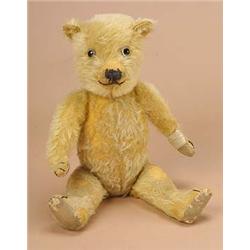 A 1930s/40s teddy bear, probably by Chiltern, the fully jointed golden plush body with fabric pads a