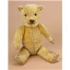 Image 1 : A 1930s/40s teddy bear, probably by Chiltern, the fully jointed golden plush body with fabric pads a