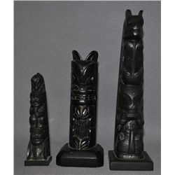 THREE NORTH WEST COAST TOTEM POLES