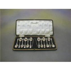 A set of 12 Old English pattern silver coffee spoons with engraved decoration Sheffield 1928,