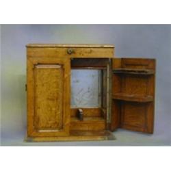 An Edwardian oak smokers cabinet enclosed by hinged and rising lid 13 