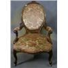 Image 1 : A Victorian carved walnutwood show frame spoon back open arm chair raised on cabriole supports