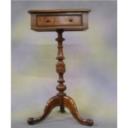 A rectangular walnutwood occasional table fitted a drawer and raised on pillar and tripod supports