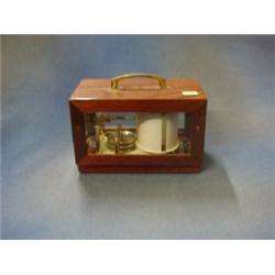 A modern barograph by Maxant, contained in a mahogany case 8"