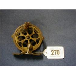 A 19th/20th Century pierced brass fishing reel 2 1/2 