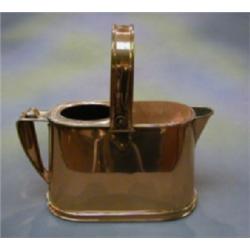 A 20th Century copper boat shaped hotwater carrier by Bulpitt & Sons dated 1916