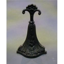 A Victorian cast iron door stop 12"