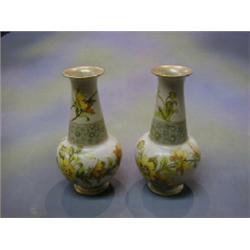 A pair of Doulton club shaped salt glazed vases with floral decoration, the bases marked Doulton