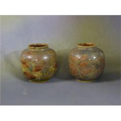 A pair of Royal Doulton circular squat vases with leaf decoration, the base marked Royal Doulton