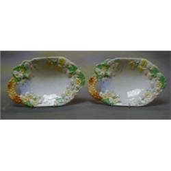 A pair of Clarice Cliff Newport Pottery oval shaped dishes decorated buttercups, the base marked