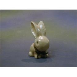 A Sylvac figure of a seated brown rabbit the base marked 990 4 