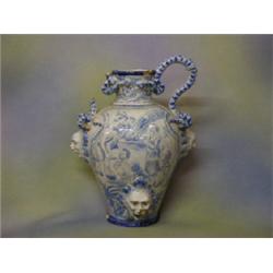 An "antique" blue and white Continental pottery twin handled urn decorated priests sacrificing a