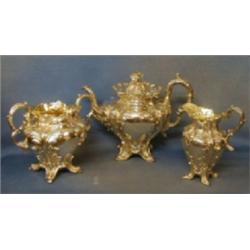 An  embossed silver Rococo style tea service, bears hallmark, 53 ozs