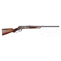 SCARCE DELUXE WINCHESTER MODEL 1886 LEVER ACTION RIFLE.