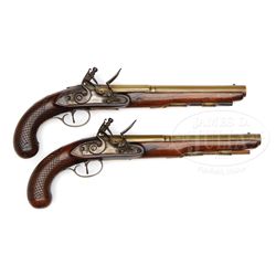 PAIR OF H. W. MORTIMER (LONDON) BRASS MOUNTED FLINTLOCK PISTOLS.