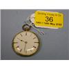 Image 1 : A yellow metal lady's open face fob watch, keywind, white enamel dial  with Roman numerals, move