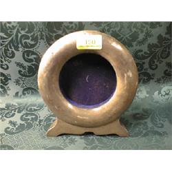 A silver Goliath watch holder.