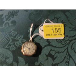 A rose gold lady's fob watch.