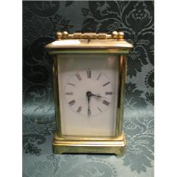 A late 19thC. brass cased carriage clock, with hour repeat movement,  striking on a bell, enamel