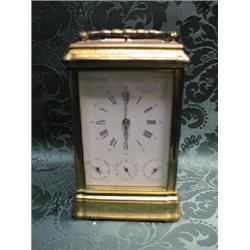 A striking and repeating carriage clock, in a plain brass case, the  white enamel dial with the h