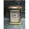 Image 1 : A carriage timepiece, in a brass case, the enamel dial with Roman  numerals, 4 1/4" high.