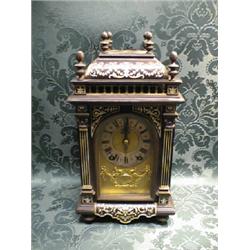 A French ebonised bracket clock inlaid profusely with arabesque,  swags and scrolls, by R & C Par