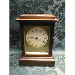 A French beech bracket timepiece of oblong construction with tablet  top, the circular enamel dia