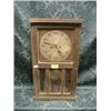 Image 1 : A 1930's oak wall clock with 30 hour movement and 3 bevel glass door,  19".