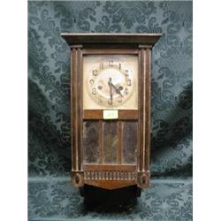 A 1930's oak wall clock with 8-day movement and 3 plate glass door,  21 .