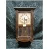 Image 1 : A 1930's oak wall clock with 8-day movement and 3 plate glass door,  21".
