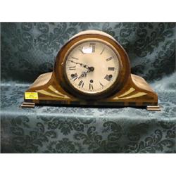 An Art Deco walnut and rosewood veneered Napoleon's hat mantel clock  with mother of pearl inlay