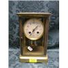 Image 1 : A French gilt brass framed 4 glass mantel clock striking on a gong  and having mercury double col