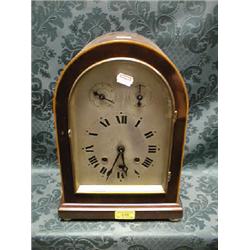 An early 20thC.. string inlaid mahogany German mantel clock with an  8-day chiming movement, 14"