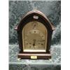 Image 1 : A 20thC.. mahogany bracket clock of arched form with string inlay and  brass bracket feet, silver