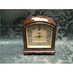 A Smith Sectric tortoiseshell effect bakelite table alarm clock, 5".