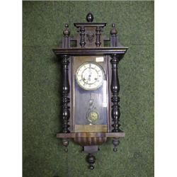 A late 19thC. German wall clock, the 2-part dial with Roman numerals,  pierced steel hands and of
