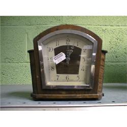 A small Enfield oak mantel clock.