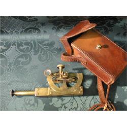 A brass pocket sextant by Troughton & Sons, leather cased.